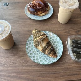 2 lattes, a breakfast sandwich, a croissant, and dolmas. 2 lattes, a breakfast sandwich, a croissant, and dolmas.