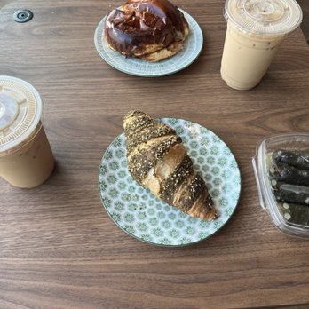 Lawadessa Cafe - 2 lattes, a breakfast sandwich, a croissant, and dolmas. - Bakeries Near Me - Mansfield, Massachusetts Lawadessa Cafe - 2 lattes, a breakfast sandwich, a croissant, and dolmas. - Bakeries Near Me - Mansfield, Massachusetts
