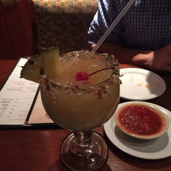 Cheddar's Scratch Kitchen - Pain Killer, a rum based drink with coconut flakes on the rim. - American Near Me - Pooler, Georgia