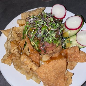 The Hideout - Ahi Poke Tower (sashimi-grade soy sesame marinated ahi, avocado, green onions, orange-ginger glaze, fried wontons) - Cocktail Bars Near Me - Aptos, California The Hideout - Ahi Poke Tower (sashimi-grade soy sesame marinated ahi, avocado, green onions, orange-ginger glaze, fried wontons) - Cocktail Bars Near Me - Aptos, California