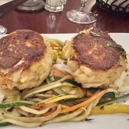 Crab cakes over mashed potatoes Crab cakes over mashed potatoes