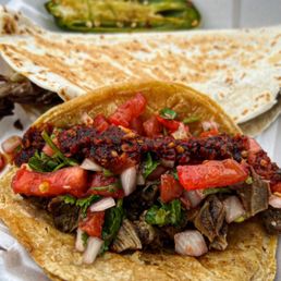a plate of tacos with meat and vegetables a plate of tacos with meat and vegetables