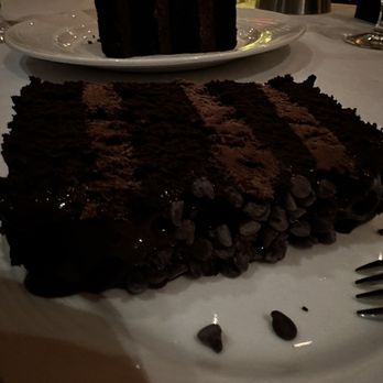 Eddie Merlot's - Chocolate cake with that espresso drizzle. Ours was a bit too cold. I bet it's amazing at room temperature. - Steakhouses Near Me - Warrenville, Illinois Eddie Merlot's - Chocolate cake with that espresso drizzle. Ours was a bit too cold. I bet it's amazing at room temperature. - Steakhouses Near Me - Warrenville, Illinois