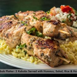 Halal Pita - Appetizing chicken kabob platters served with humus, salad, rice and pita bread