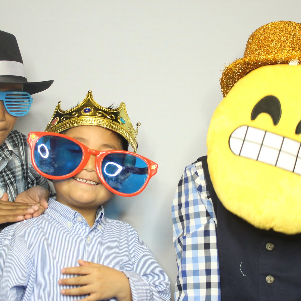 Kids enjoying the photo booth at their grandfathers birthday bash Kids enjoying the photo booth at their grandfathers birthday bash
