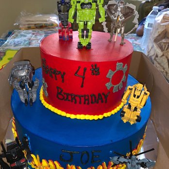 Golden Cake - Transformer birthday cake, we ordered the toys my son loves online from amazon and the baker assembled everything how we envisioned. - Bakeries Near Me - Las Vegas, Nevada Golden Cake - Transformer birthday cake, we ordered the toys my son loves online from amazon and the baker assembled everything how we envisioned. - Bakeries Near Me - Las Vegas, Nevada