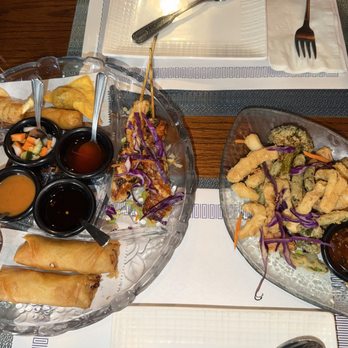 Ruan Thai Cuisine - Combination plate with egg rolls, chicken sautay, chicken curry crispy wonton, dumplings, and crispy shrimp and calamari to the right - Thai Near Me - Savannah, Georgia Ruan Thai Cuisine - Combination plate with egg rolls, chicken sautay, chicken curry crispy wonton, dumplings, and crispy shrimp and calamari to the right - Thai Near Me - Savannah, Georgia