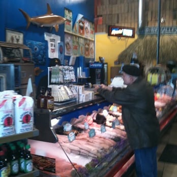 Johnny's Fresh Fish & Seafood - a man in a store - Seafood Markets Near Me - Barrie, Ontario Johnny's Fresh Fish & Seafood - a man in a store - Seafood Markets Near Me - Barrie, Ontario