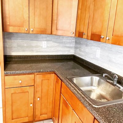 T J Lewis Home Repair Logo