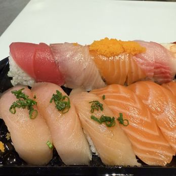 Flakes - Rainbow, yellowtail nigiri, salmon nigiri (incredibly glossy) - Sushi Bars Near Me - Tucson, Arizona Flakes - Rainbow, yellowtail nigiri, salmon nigiri (incredibly glossy) - Sushi Bars Near Me - Tucson, Arizona