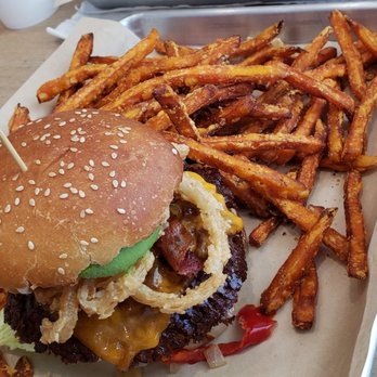 Mooyah - a burger and french fries on a tray - Burgers Near Me - Chilliwack, British Columbia