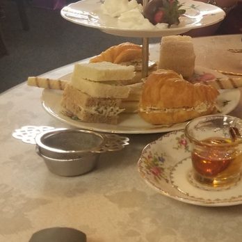 Enchanted Rose Tea Parlour - Tier of savory British mini sandwiches and at the top there are chocolate - Dipped Strawberries - Coffee & Tea Near Me - San Dimas, California Enchanted Rose Tea Parlour - Tier of savory British mini sandwiches and at the top there are chocolate - Dipped Strawberries - Coffee & Tea Near Me - San Dimas, California