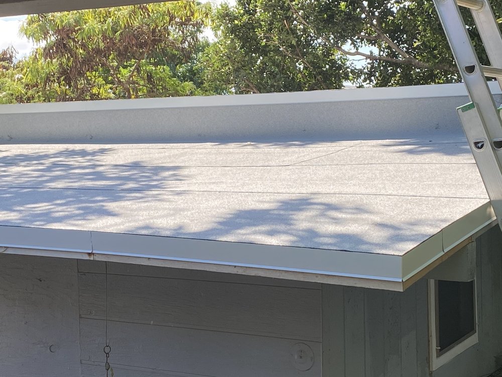 Slide of J&E ROOFING