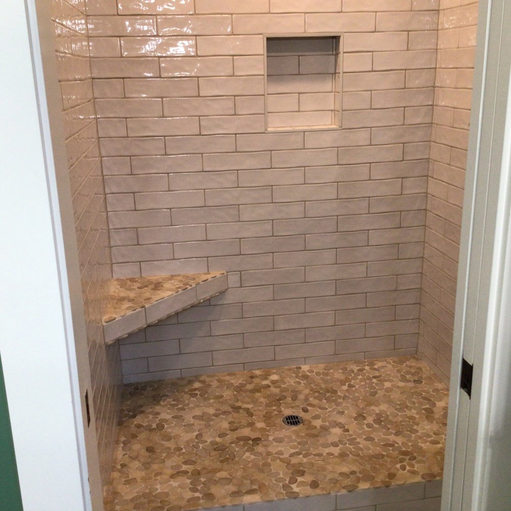 Ridgeline Tile - a corner shower in a bathroom - Tiling Near Me Ridgeline Tile - a corner shower in a bathroom - Tiling Near Me