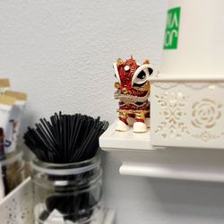 Shaw Dental Group - Cute lion with good coffee.