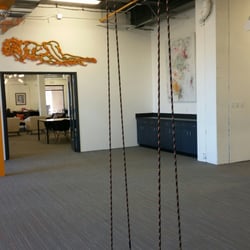 Advent Coworking - Inside the large event space. Yes, that is a swing :)