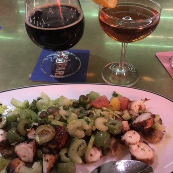 Bar Corallini - Octopus and midnight cocktail - Bars Near Me - Madison, Wisconsin Bar Corallini - Octopus and midnight cocktail - Bars Near Me - Madison, Wisconsin