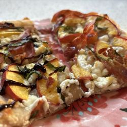 Olive Hill Farm - Peach and goat cheese flatbread topped with glazed onion aged balsamic and Herbs de Provence oil.