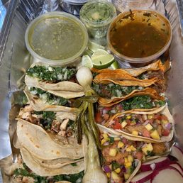 10 Tacos - clockwise from bottom left: chicken, al pastor, birria, and fish 10 Tacos - clockwise from bottom left: chicken, al pastor, birria, and fish