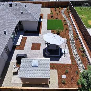 Oscar Landscaping - Backyard paver patio, gravel, drainage creek, Allan Block retaining wall - Landscaping Near Me - Concord, California Oscar Landscaping - Backyard paver patio, gravel, drainage creek, Allan Block retaining wall - Landscaping Near Me - Concord, California