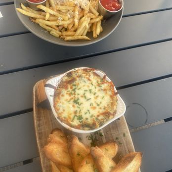 SupperClub SouthEnd - Spinach and Artichoke Dip Truffle Fries - Cocktail Bars Near Me - Charlotte, North Carolina SupperClub SouthEnd - Spinach and Artichoke Dip Truffle Fries - Cocktail Bars Near Me - Charlotte, North Carolina