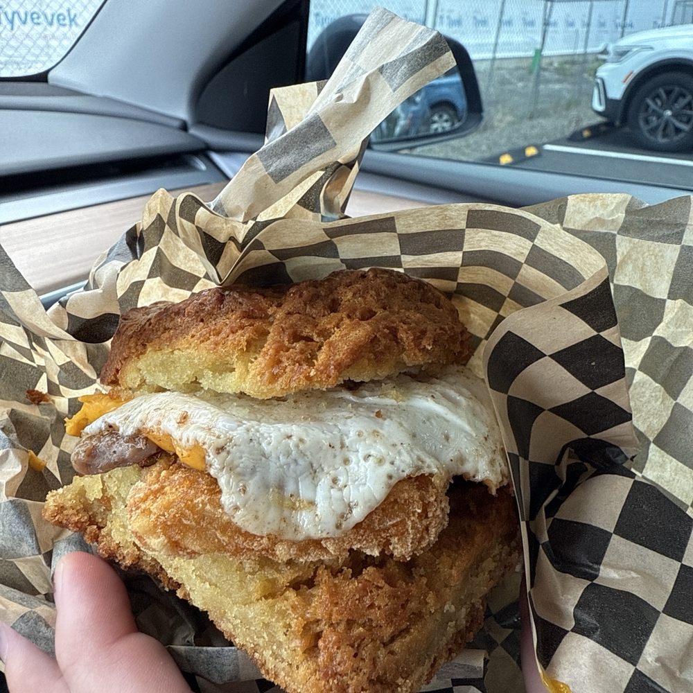 Sausage sandwich on a biscuit with hash brown Sausage sandwich on a biscuit with hash brown