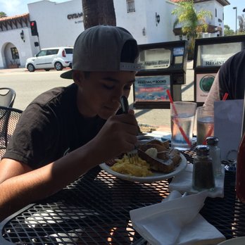 Sunrise Cafe - My stepson, Justin, enjoying his breakfast of French Toast and Scrambled Eggs. - American Near Me - San Clemente, California Sunrise Cafe - My stepson, Justin, enjoying his breakfast of French Toast and Scrambled Eggs. - American Near Me - San Clemente, California