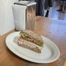 Half of my turkey provolone sandwich Half of my turkey provolone sandwich