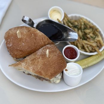 Tavern on the Green - Shaved sirloin steak sandwich with truffle fries - New American Near Me - New York, New York Tavern on the Green - Shaved sirloin steak sandwich with truffle fries - New American Near Me - New York, New York