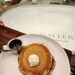 Corner Bakery - Their delicious, moist, pancakes! I enjoy these with honey over syrup.