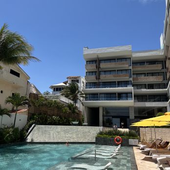 The Fives Oceanfront - View from pool, looking back at hotel building - Hotels Near Me - Puerto Morelos, ROO