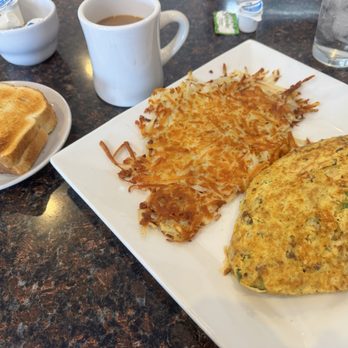 Two Partners Family Restaurant - Skirt steak omelet with hash-browns and sourdough bread. - Breakfast & Brunch Near Me - Plano, Illinois