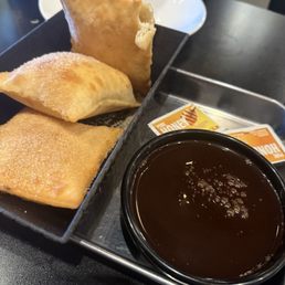 Sopapillas with chocolate and honey packets Sopapillas with chocolate and honey packets