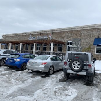 Laura's Bar And Grill - Tons of parking and lot is full on a Tuesday at noon. Outdoor dining on patio with fireplace. - American Near Me - Smithfield, Rhode Island Laura's Bar And Grill - Tons of parking and lot is full on a Tuesday at noon. Outdoor dining on patio with fireplace. - American Near Me - Smithfield, Rhode Island