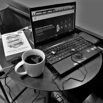 Starbucks - a cup of coffee and a laptop on a table - Coffee & Tea Near Me - Vancouver, British Columbia Starbucks - a cup of coffee and a laptop on a table - Coffee & Tea Near Me - Vancouver, British Columbia
