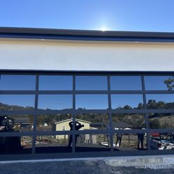 A & L Garage Doors - 18x7-9 Aluminum door, black frame, black glass can't see through.