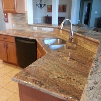 Fox Granite - Creme Bordeaux Granite. Tile from The Tile Shop, 60/40 sink with Delta DeLuca faucet. - Building Supplies Near Me - Austin, Texas