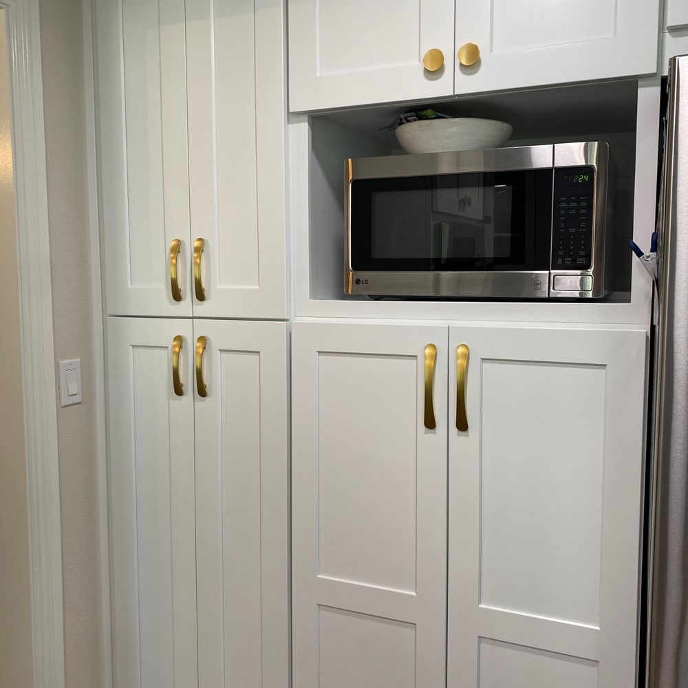 Berger Hardware - a kitchen with white cabinets and a microwave - Cabinetry Near Me - Encinitas, California