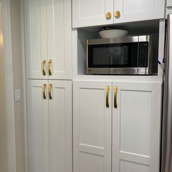Berger Hardware - a kitchen with white cabinets and a microwave - Cabinetry Near Me - Encinitas, California