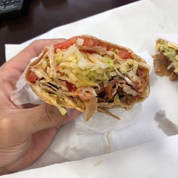 J & V Deli And Pizzeria - a hand holding a burrito - Sandwiches Near Me - Central Islip, New York J & V Deli And Pizzeria - a hand holding a burrito - Sandwiches Near Me - Central Islip, New York