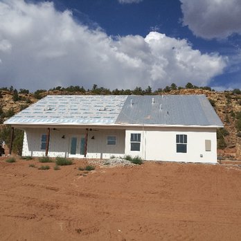 EL Cap Builders - a white building with a blue roof - General Contractors Near Me - Hurricane, Utah EL Cap Builders - a white building with a blue roof - General Contractors Near Me - Hurricane, Utah