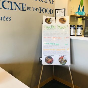 Mountain Juicery - a sign in front of a counter - Juice Bars & Smoothies Near Me - Asheville, North Carolina