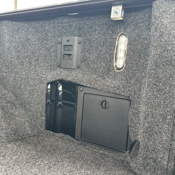 AutoNation Ford Littleton - Storage Bin...AutoNation's work.  Giant misshapen hole with exposed bed. - Car Dealers Near Me - Littleton, Colorado
