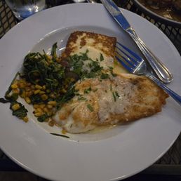 Red Snapper with beurre blanc sauce, spinach with crispy corn, and crab polenta
