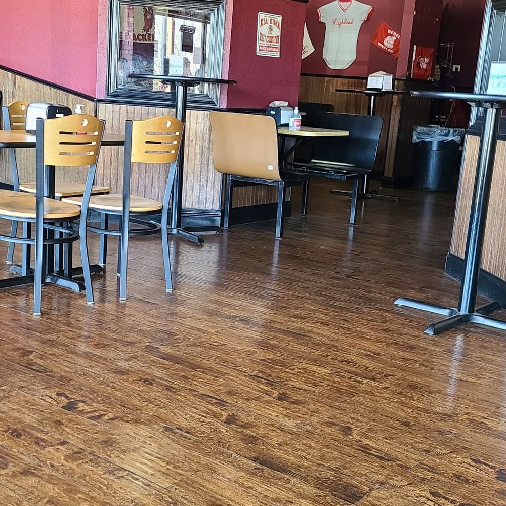 a table and chairs in a restaurant a table and chairs in a restaurant