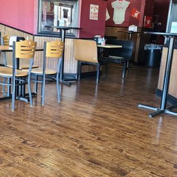 a table and chairs in a restaurant a table and chairs in a restaurant