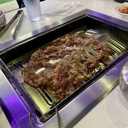 Single round of bulgogi on grill - mouth wateringly delicious. They do the grilling, decent portion sizes for each round of meat