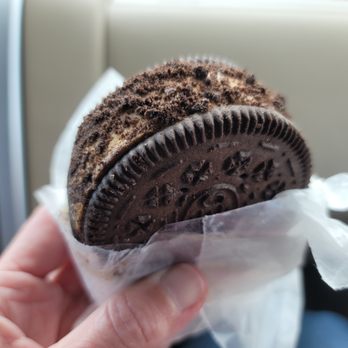 Paradise Ice Cream - a hand holding an oreo sandwich - Ice Cream & Frozen Yogurt Near Me - Springfield, Virginia Paradise Ice Cream - a hand holding an oreo sandwich - Ice Cream & Frozen Yogurt Near Me - Springfield, Virginia