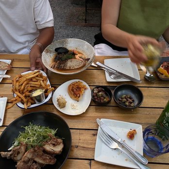 N 7 - Chicken karaage, pomme frites, bouillabaisse, squid and watermelon salad, olive plate, bread plate - French Near Me - New Orleans, Louisiana N 7 - Chicken karaage, pomme frites, bouillabaisse, squid and watermelon salad, olive plate, bread plate - French Near Me - New Orleans, Louisiana