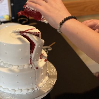 Grant's Bakery - a person decorating a cake - Bakeries Near Me - Lewiston, Maine
